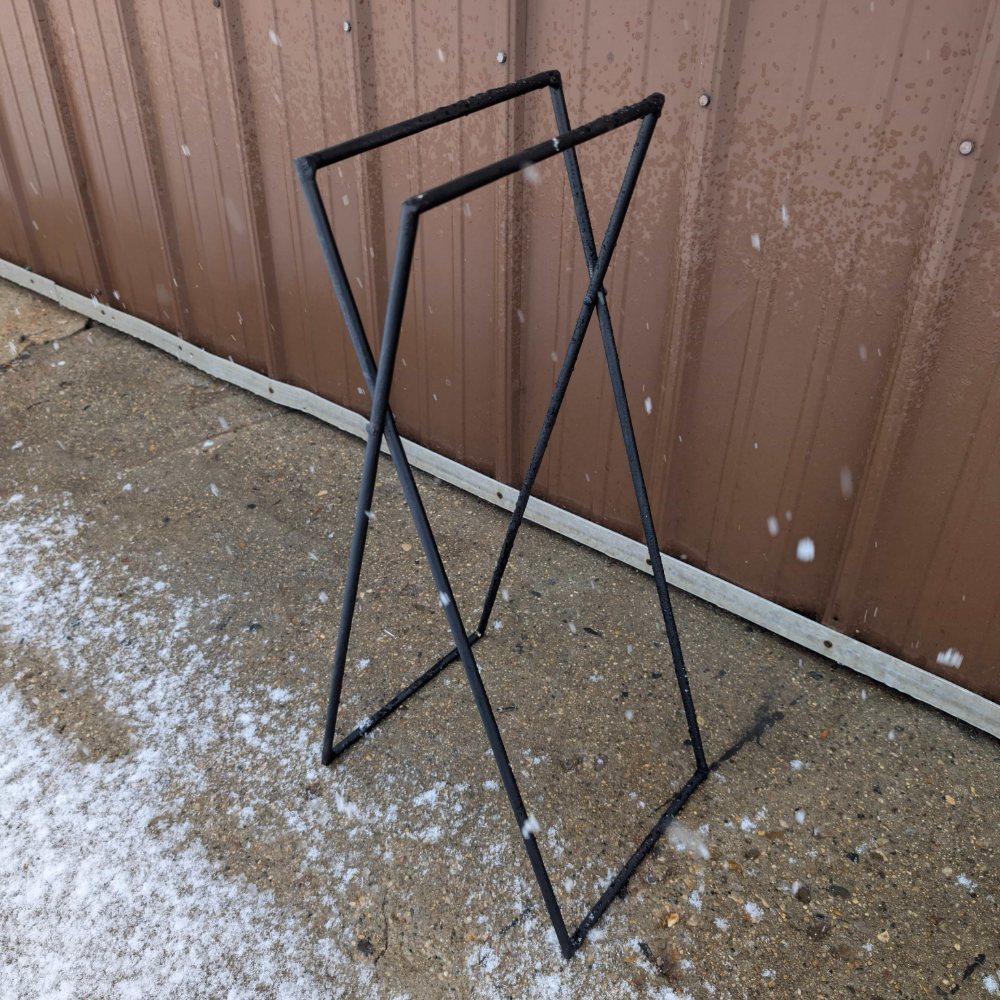 The bare steel frame standing unfolded