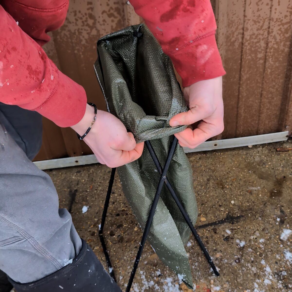 Cuffing the top of the bag over the frame