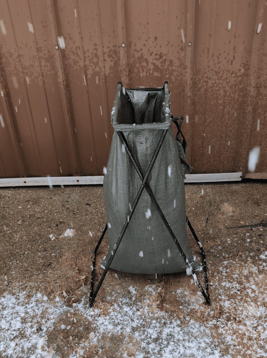 The stand holding the bag open by itself